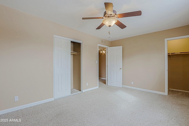 unfurnished bedroom featuring carpet, a closet, visible vents, and baseboards