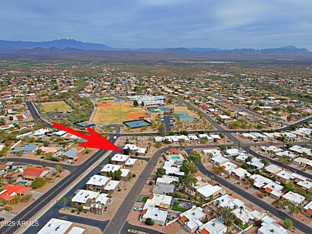 drone / aerial view featuring a residential view and a mountain view