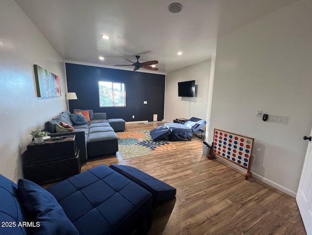 living area with a ceiling fan, baseboards, wood finished floors, and recessed lighting