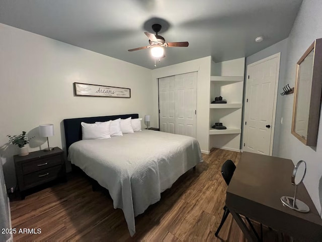 bedroom with dark wood-style flooring, a closet, and a ceiling fan