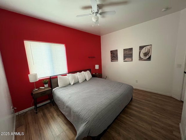 bedroom featuring ceiling fan, baseboards, and wood finished floors