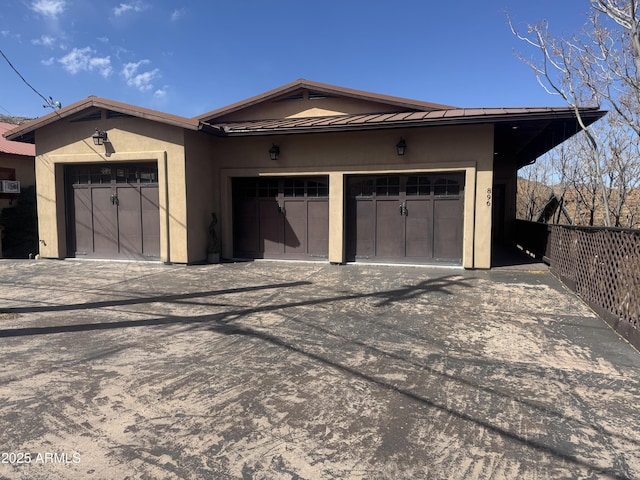 garage featuring driveway