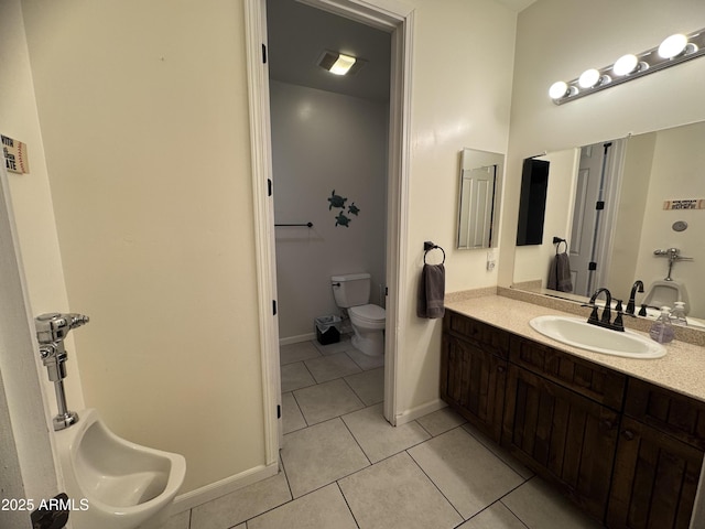 bathroom with visible vents, baseboards, toilet, tile patterned flooring, and vanity