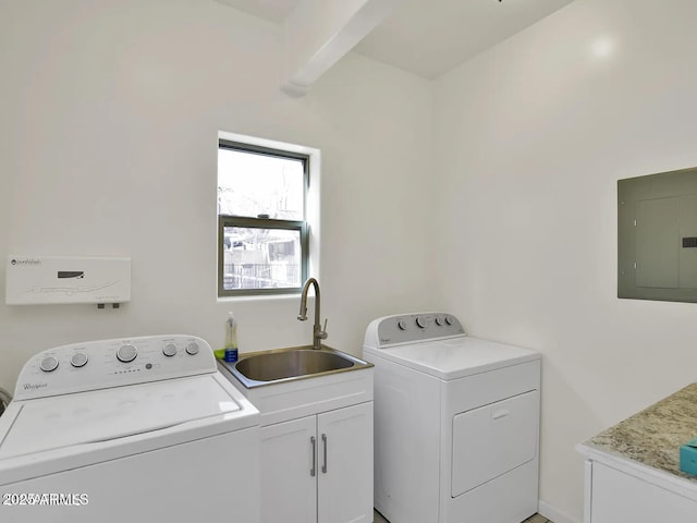 laundry room with washer and dryer, electric panel, a sink, and cabinet space