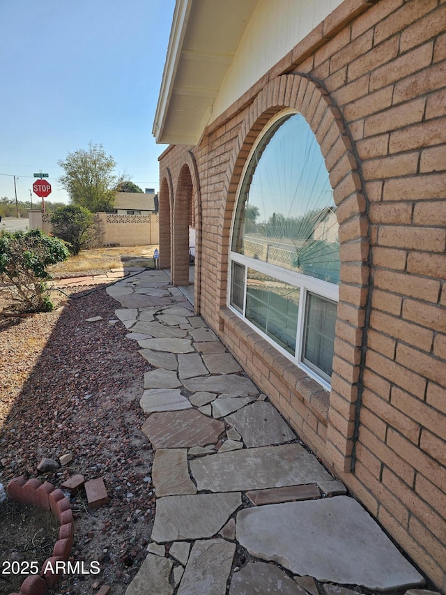 view of side of property with a patio area