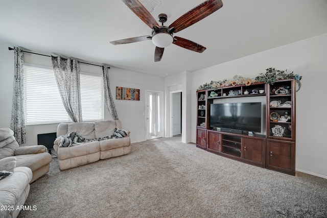 living room with carpet floors and ceiling fan