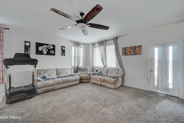 living room with ceiling fan and carpet flooring