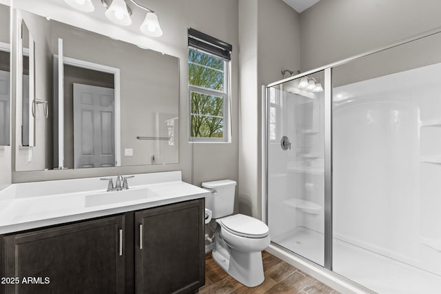 4244 Sawbuck Way, Wickenburg, AZ 85390 - full bath with a stall shower, toilet, wood finished floors, and vanity