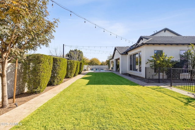 view of yard with a fenced backyard and a patio