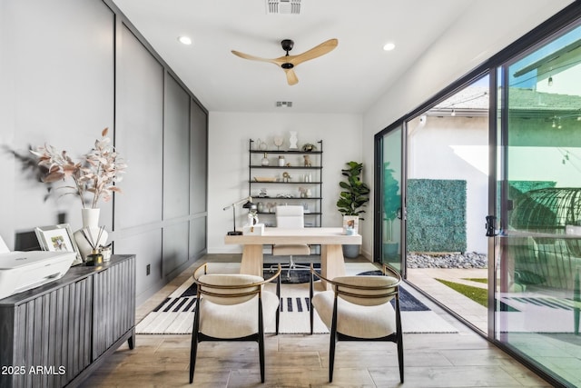 office space with recessed lighting, visible vents, ceiling fan, and wood finished floors