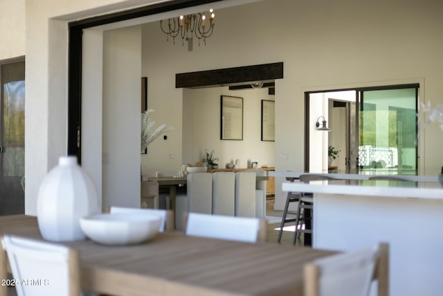 dining space featuring a notable chandelier