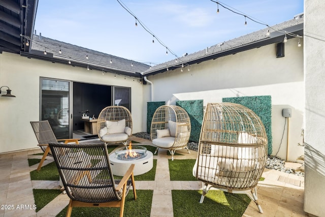 view of patio / terrace with a fire pit