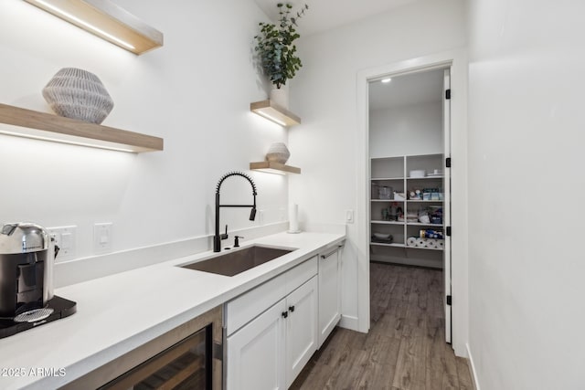 bar featuring wood finished floors and a sink