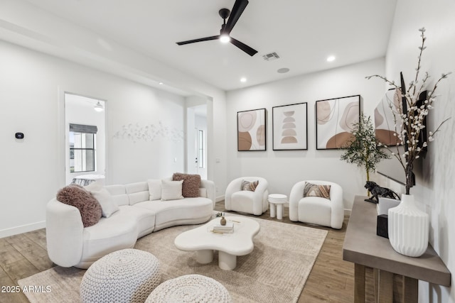 living room featuring visible vents, wood finished floors, a ceiling fan, and recessed lighting