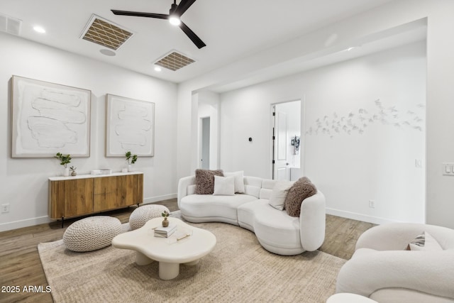 living room with recessed lighting, wood finished floors, visible vents, and a ceiling fan