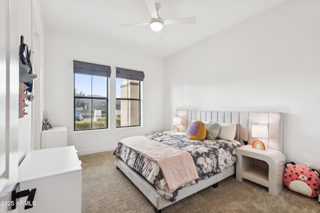 carpeted bedroom with ceiling fan and baseboards