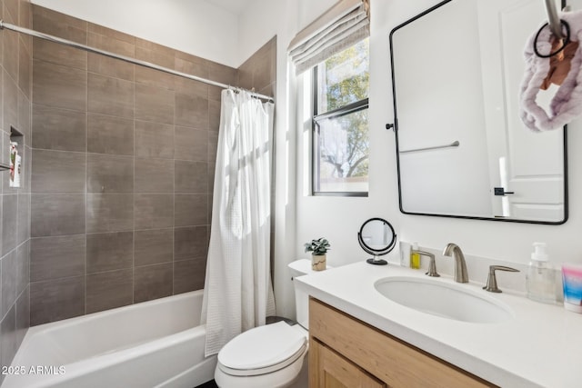 full bath with shower / bathtub combination with curtain, vanity, and toilet