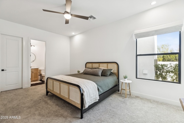 bedroom featuring recessed lighting, visible vents, ensuite bathroom, light carpet, and baseboards