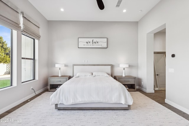 bedroom with visible vents, baseboards, ceiling fan, wood finished floors, and recessed lighting