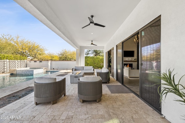 view of patio with a pool with connected hot tub, outdoor lounge area, ceiling fan, and a fenced backyard