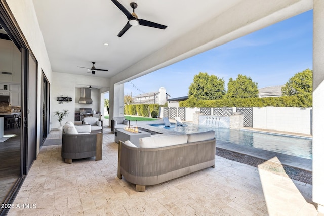 view of patio / terrace with a ceiling fan, an outdoor living space with a fire pit, and a fenced backyard