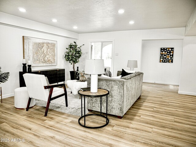 6401 E Eugie Ter, Scottsdale, AZ 85254 - living room with light wood finished floors, recessed lighting, and baseboards