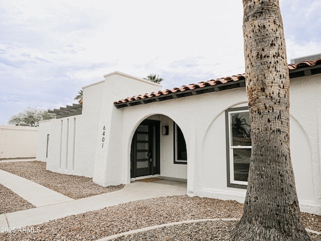 6401 E Eugie Ter, Scottsdale, AZ 85254 - view of side of property with a tile roof and stucco siding
