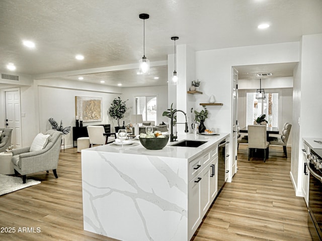 6401 E Eugie Ter, Scottsdale, AZ 85254 - kitchen with open floor plan, a sink, light wood-style floors, white cabinetry, and recessed lighting