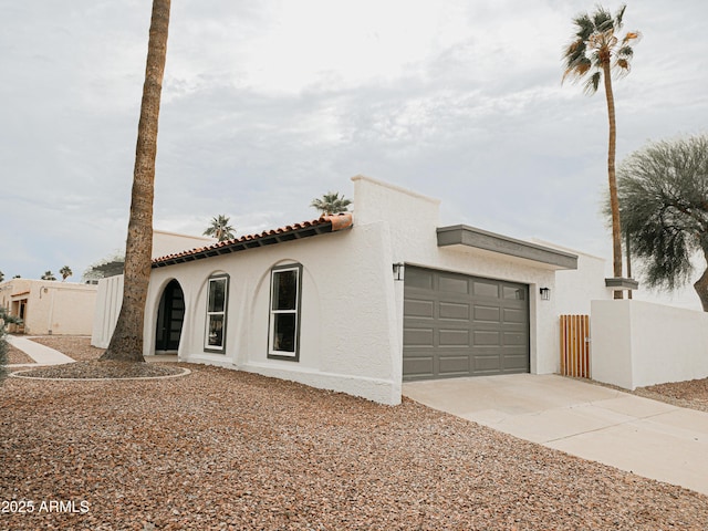 6401 E Eugie Ter, Scottsdale, AZ 85254 - view of front facade with an attached garage, stucco siding, concrete driveway, and a tiled roof