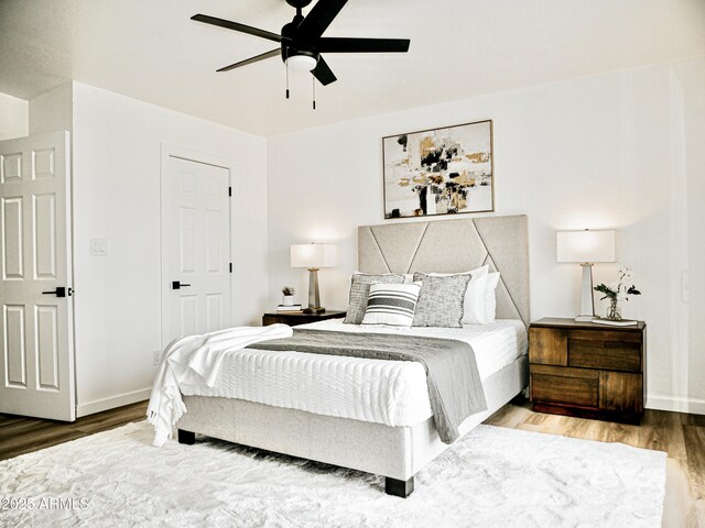 6401 E Eugie Ter, Scottsdale, AZ 85254 - bedroom featuring wood finished floors, ceiling fan, and baseboards