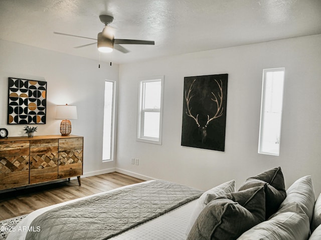 6401 E Eugie Ter, Scottsdale, AZ 85254 - bedroom featuring wood finished floors, baseboards, and ceiling fan