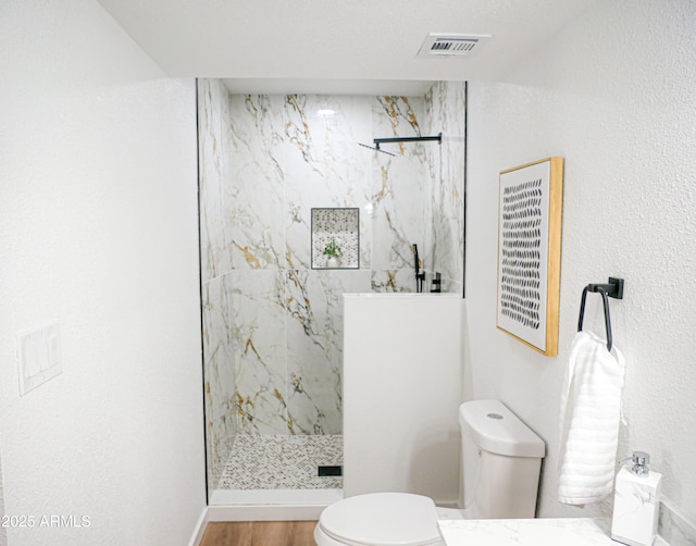 6401 E Eugie Ter, Scottsdale, AZ 85254 - full bath featuring toilet, a marble finish shower, and wood finished floors