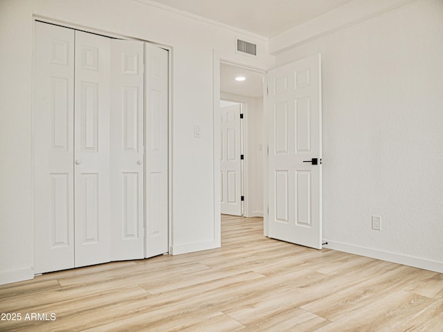 6401 E Eugie Ter, Scottsdale, AZ 85254 - unfurnished bedroom featuring light wood-type flooring, a closet, and baseboards