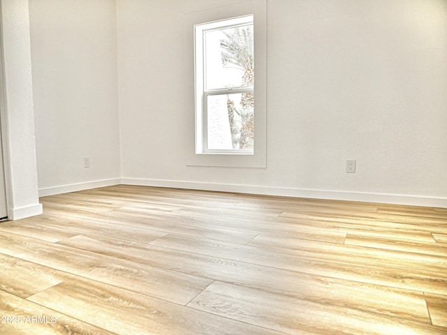 6401 E Eugie Ter, Scottsdale, AZ 85254 - unfurnished room with baseboards and light wood-type flooring