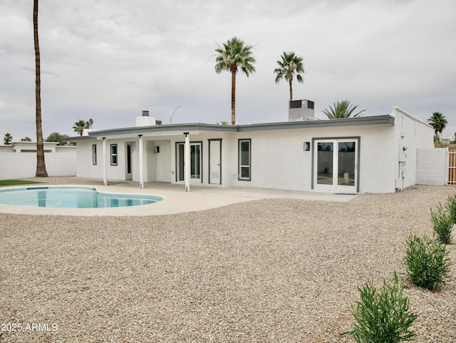 6401 E Eugie Ter, Scottsdale, AZ 85254 - back of house featuring stucco siding, a patio, and a chimney