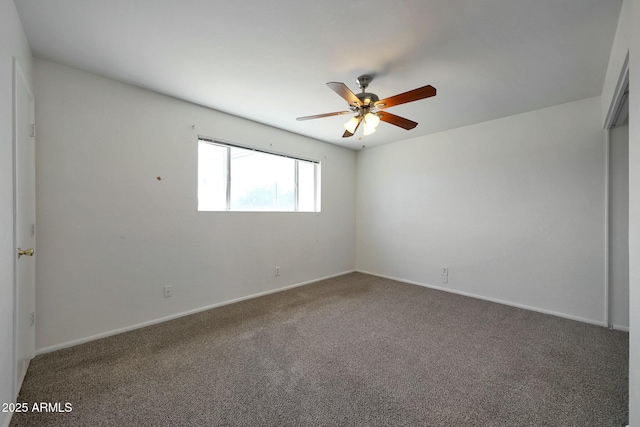 unfurnished room featuring baseboards, a ceiling fan, and carpet flooring