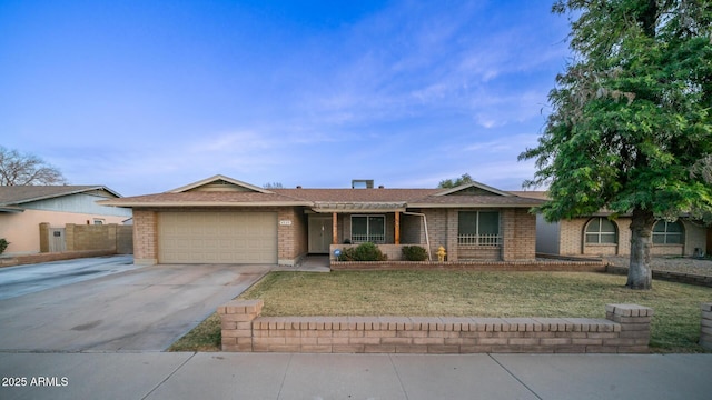 ranch-style home featuring a garage and a front lawn