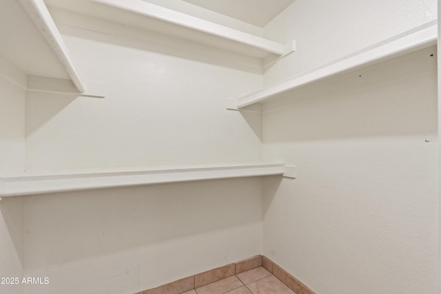 walk in closet featuring light tile patterned floors