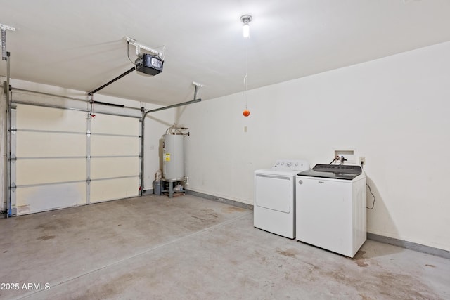 garage featuring washer and dryer, baseboards, a garage door opener, and water heater