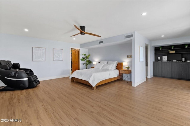 bedroom with light wood-type flooring and ceiling fan