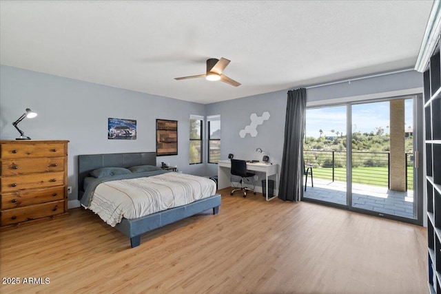 bedroom with hardwood / wood-style floors, access to outside, and ceiling fan