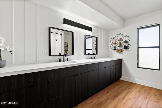 bathroom featuring vanity and wood-type flooring