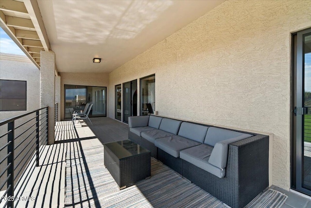 wooden deck featuring an outdoor hangout area