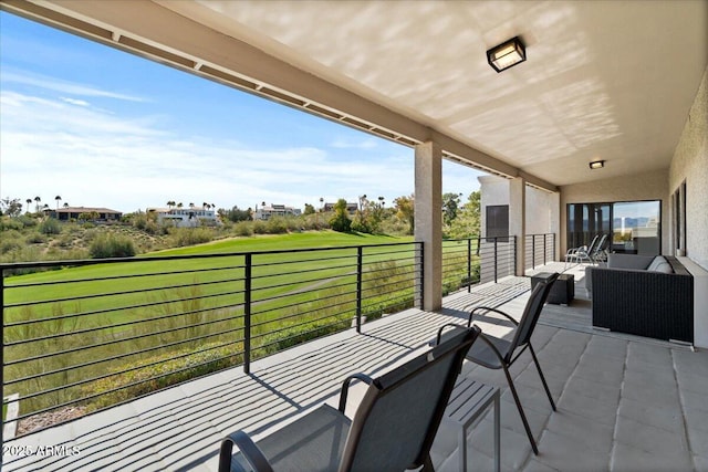 view of patio / terrace with an outdoor living space and a balcony