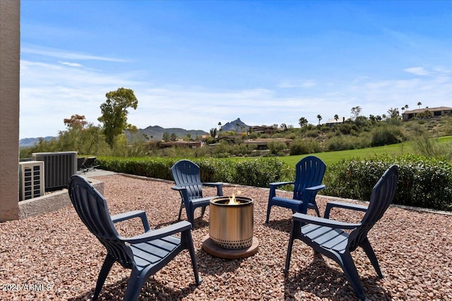 view of patio with central AC and a mountain view