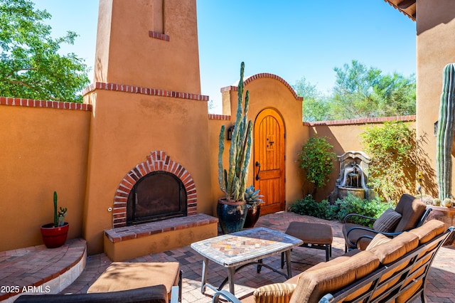 view of patio / terrace featuring outdoor lounge area and fence