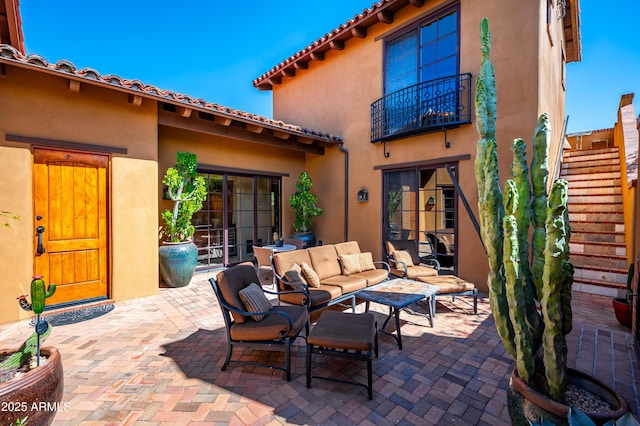 view of patio / terrace featuring a balcony and outdoor lounge area