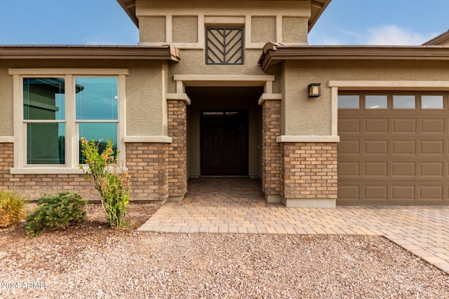 entrance to property featuring a garage