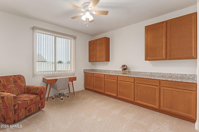 interior space featuring ceiling fan and light colored carpet