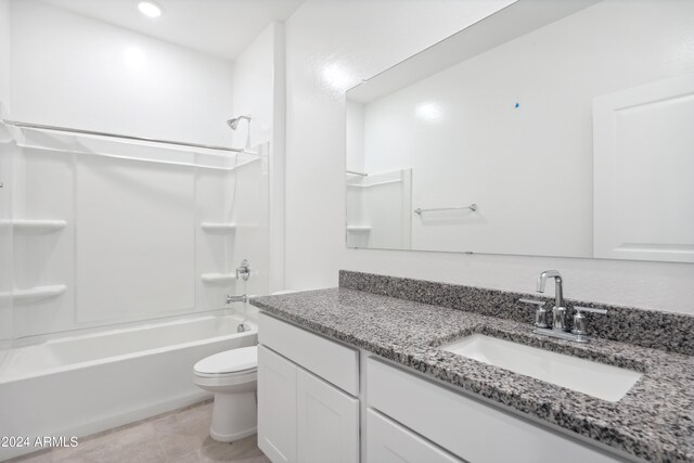 full bathroom featuring vanity, tile patterned floors, toilet, and  shower combination